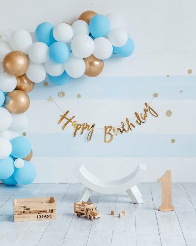 Birthday decorations with balloons. Festive room decoration in blue color with balloons